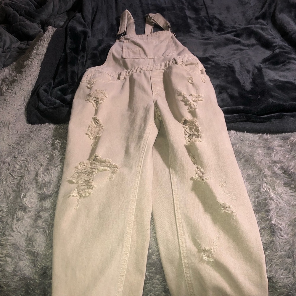 Distressed jean overalls